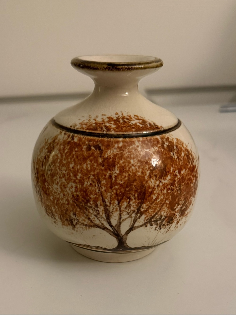 Vintage ceramic bud vase. Small crack on top. Could date back to 1970s